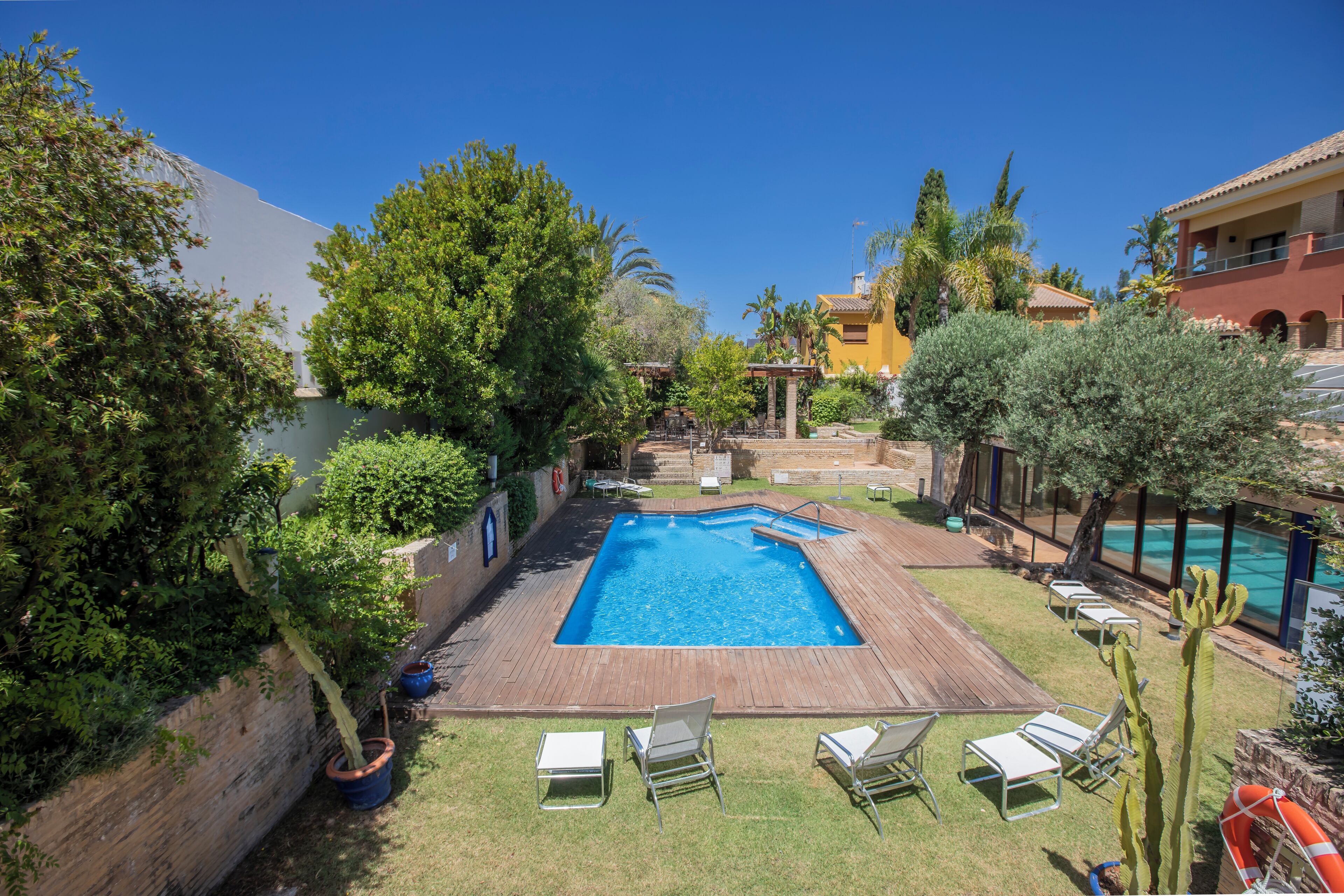 indoor pool, seasonal outdoor pool, pool umbrellas, pool loungers