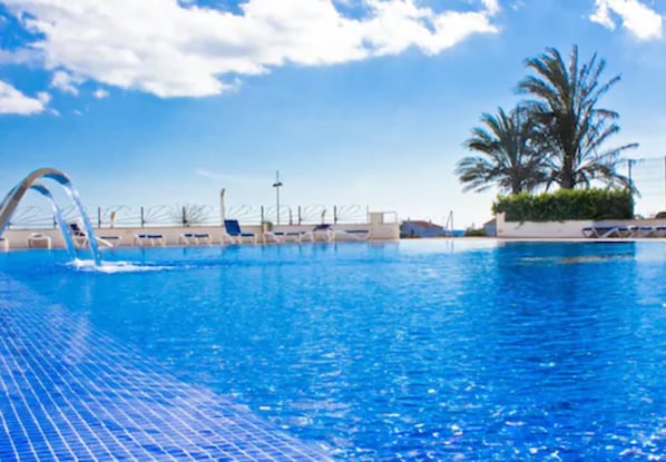 Outdoor pool, pool umbrellas, pool loungers