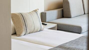 Desk, laptop workspace, blackout drapes, bed sheets
