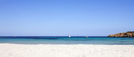 On the beach, sun-loungers, beach umbrellas, beach towels