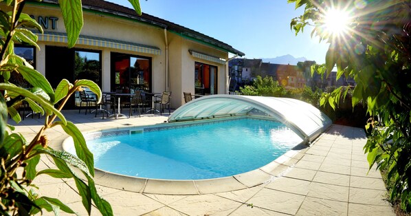 Seasonal outdoor pool, pool umbrellas, pool loungers