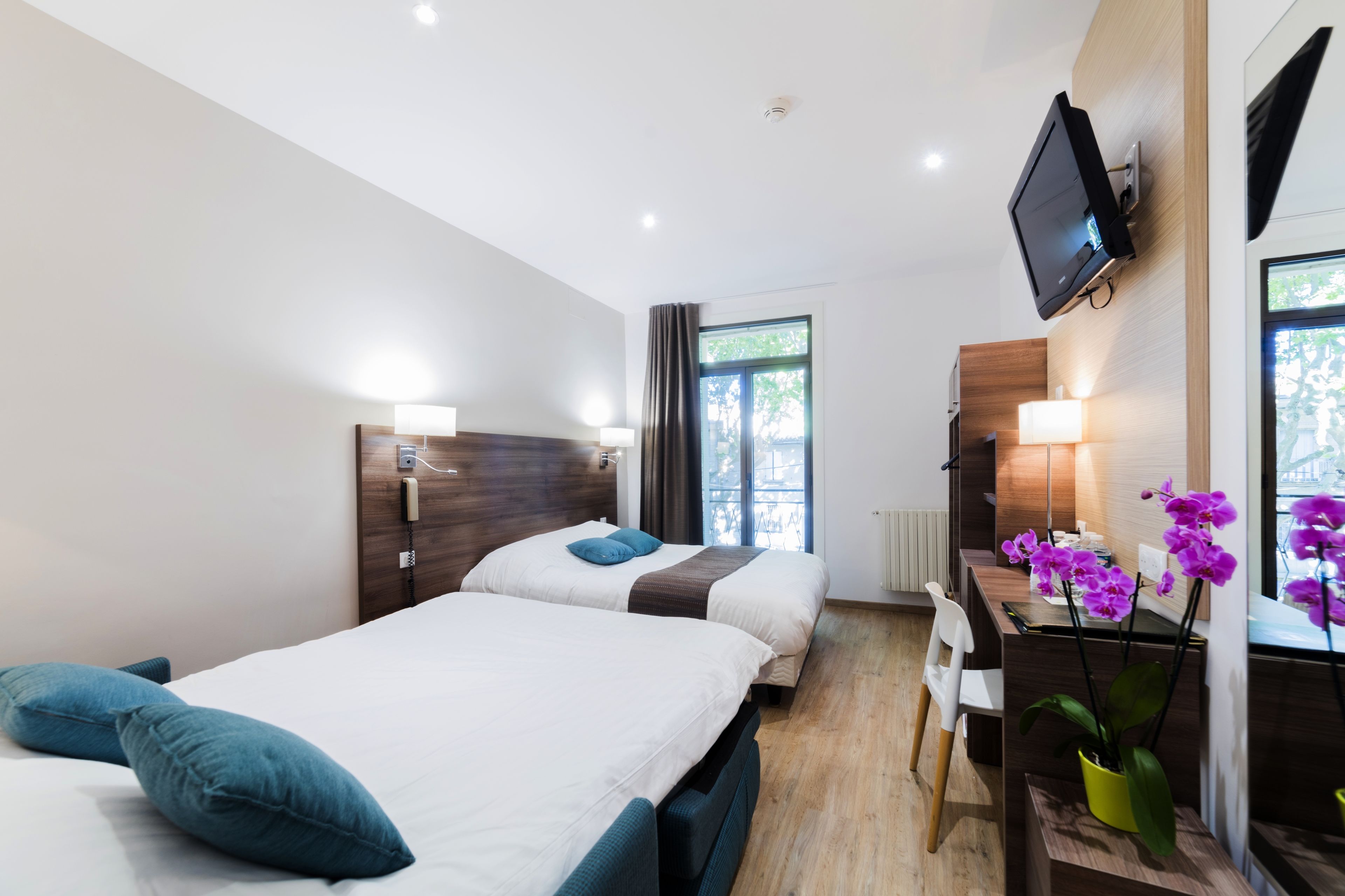 deluxe quadruple room, 2 bedrooms | in-room safe, desk, laptop workspace, iron/ironing board