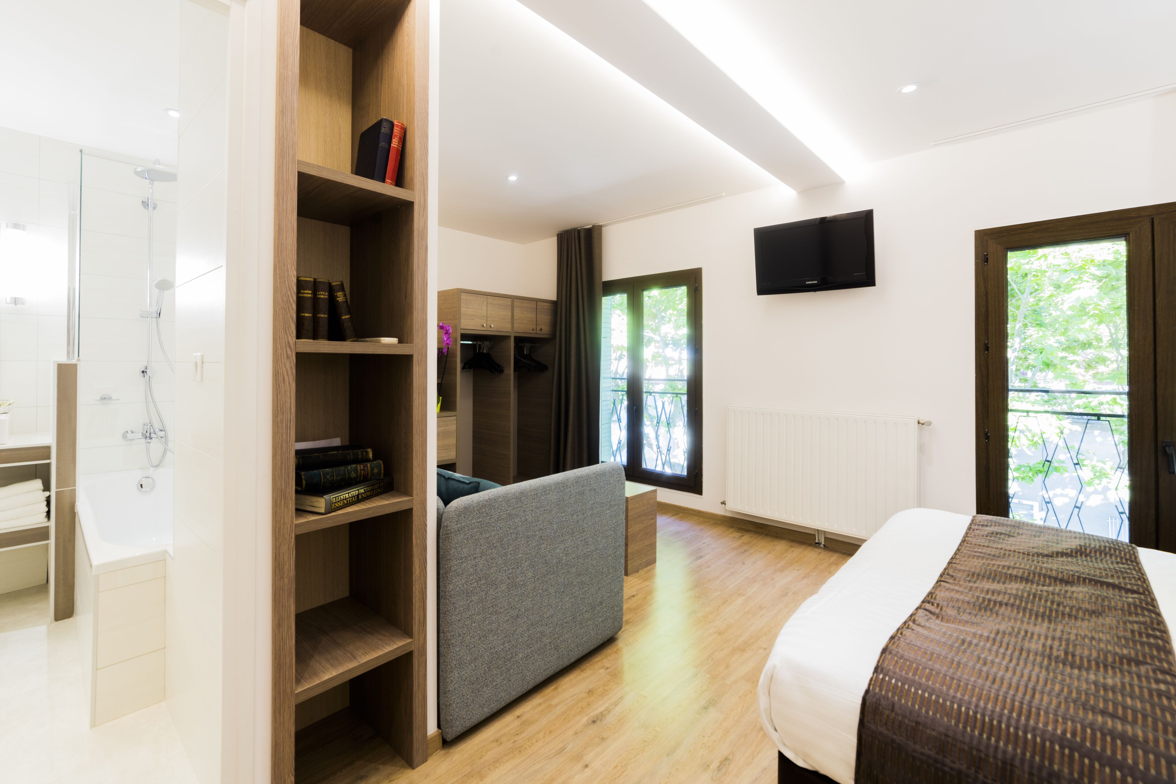 quadruple room, bathtub | in-room safe, desk, laptop workspace, iron/ironing board