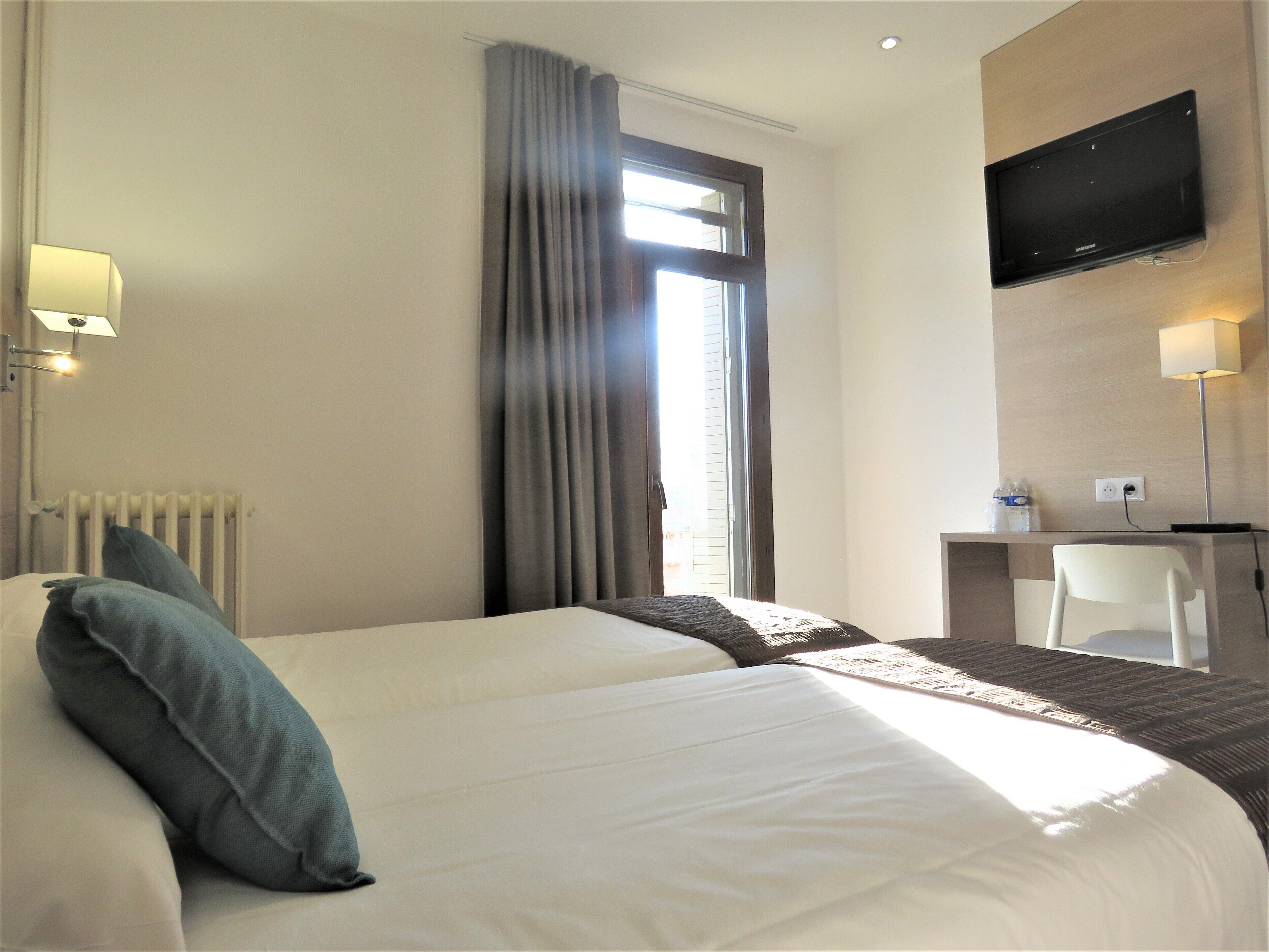 twin room | in-room safe, desk, laptop workspace, iron/ironing board