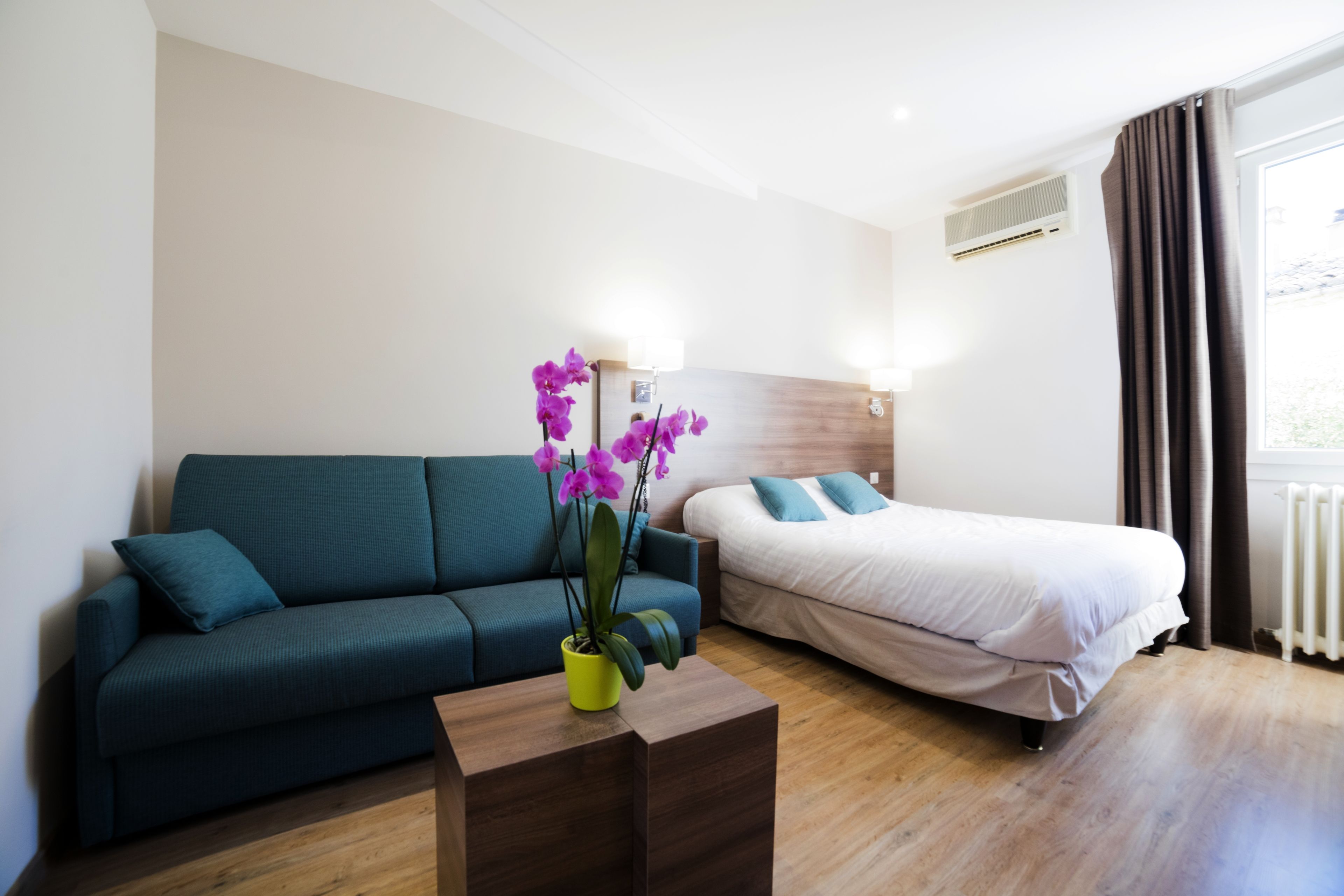 deluxe quadruple room, 2 bedrooms | in-room safe, desk, laptop workspace, iron/ironing board