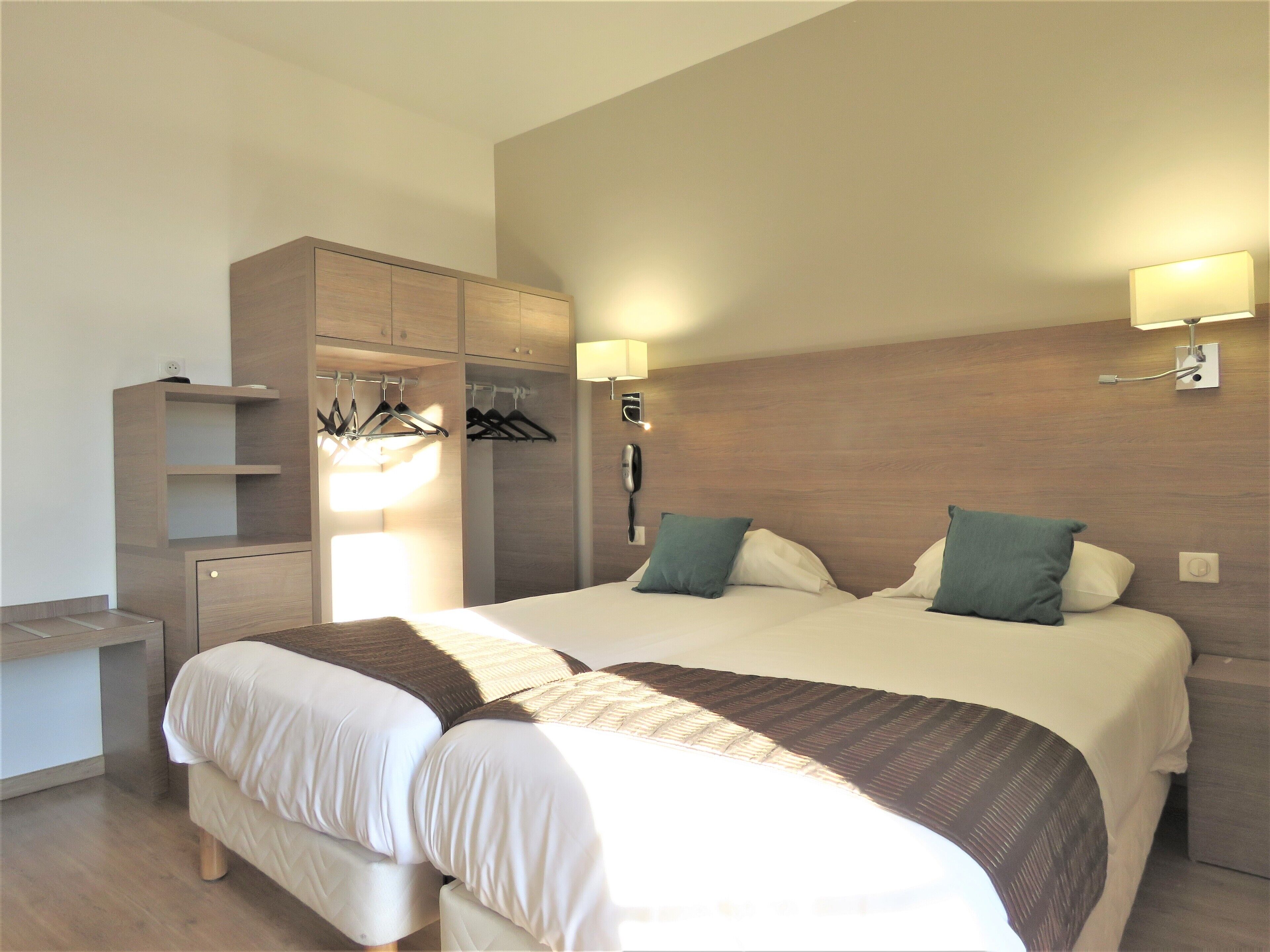 twin room | in-room safe, desk, laptop workspace, iron/ironing board