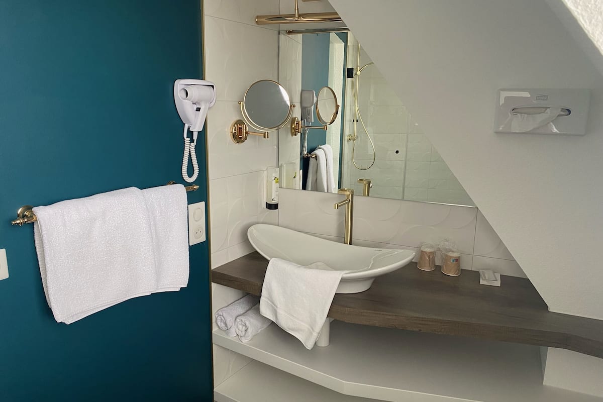 superior twin room | bathroom | hair dryer, towels