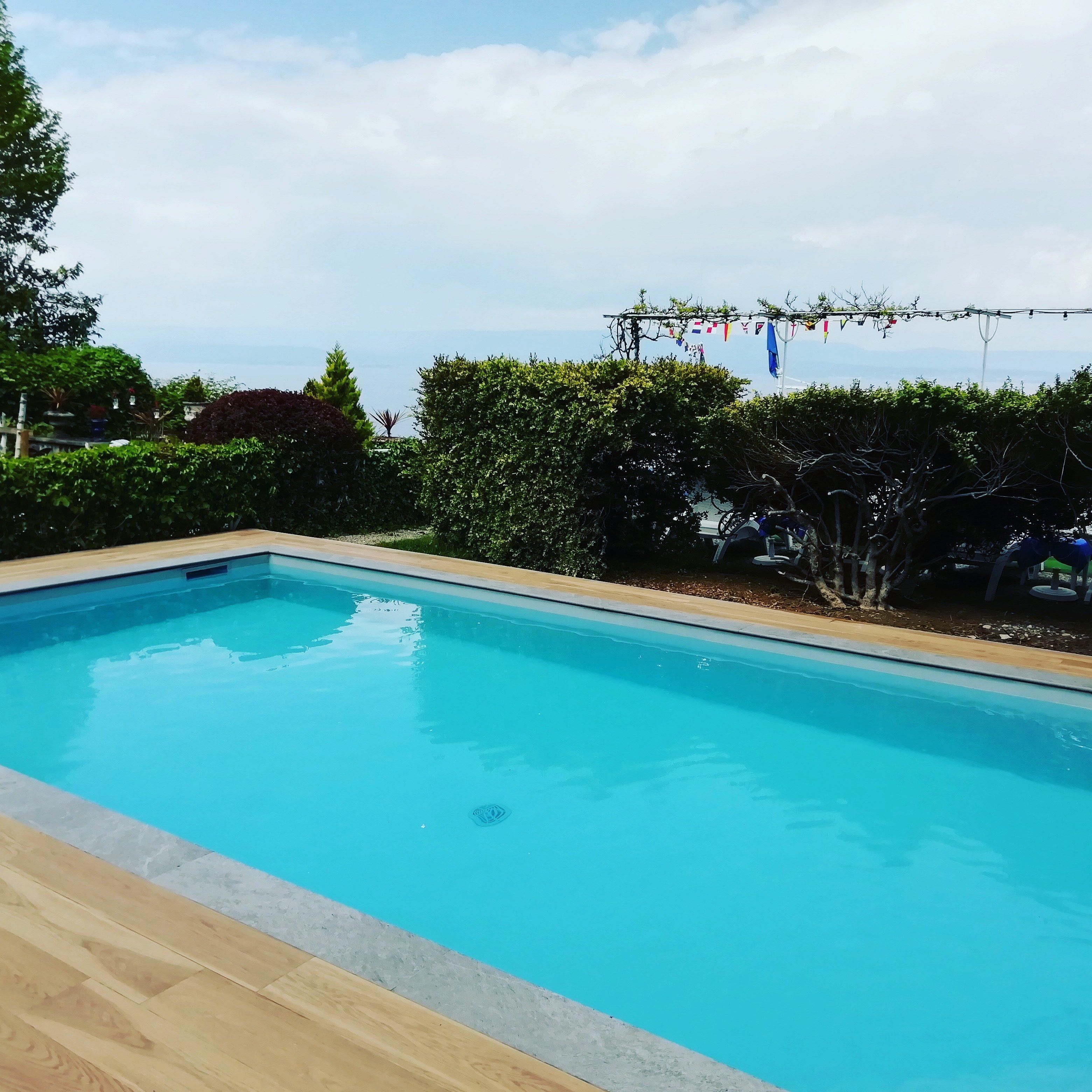 seasonal outdoor pool, pool umbrellas, pool loungers