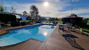 Seasonal outdoor pool, open 9:00 AM to 9:00 PM, pool loungers
