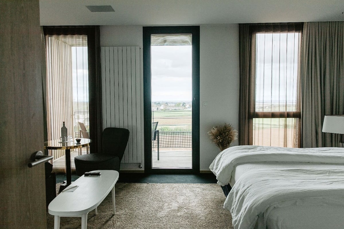 junior suite, 1 king bed with sofa bed | premium bedding, in-room safe, desk, blackout curtains