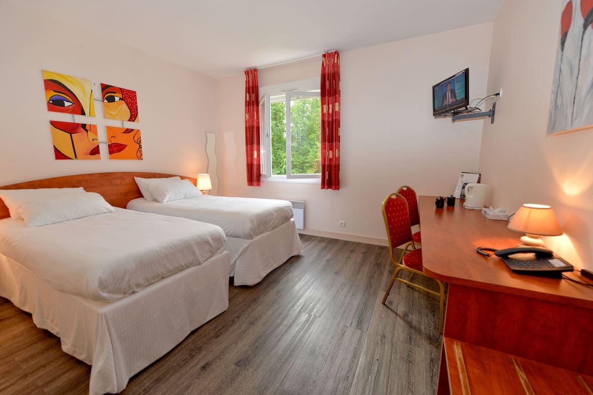 twin room | premium bedding, desk, laptop workspace, cots/infant beds