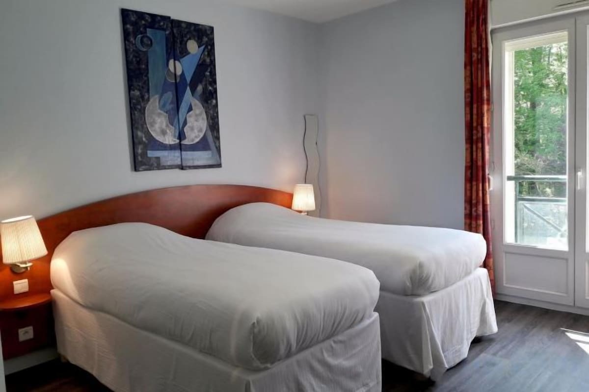Premium bedding, desk, laptop workspace, soundproofing
