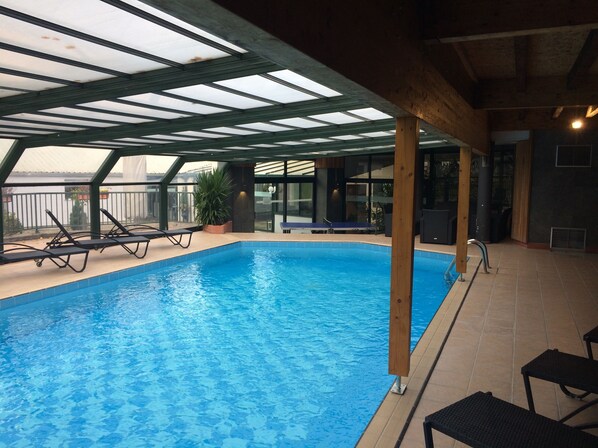 Indoor pool, outdoor pool, open 8:00 AM to 8:00 PM, pool loungers