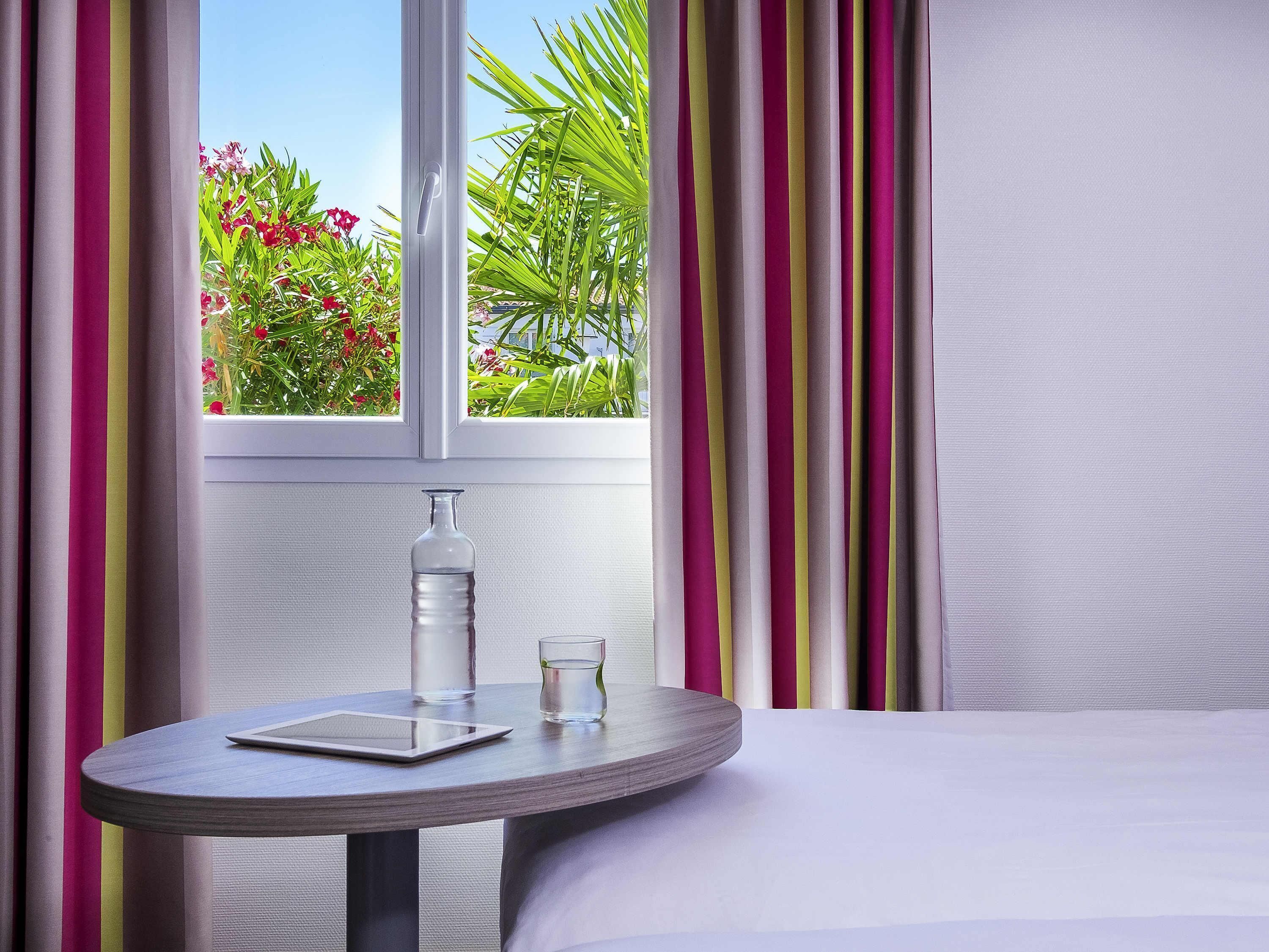 Premium bedding, pillow-top beds, desk, blackout curtains