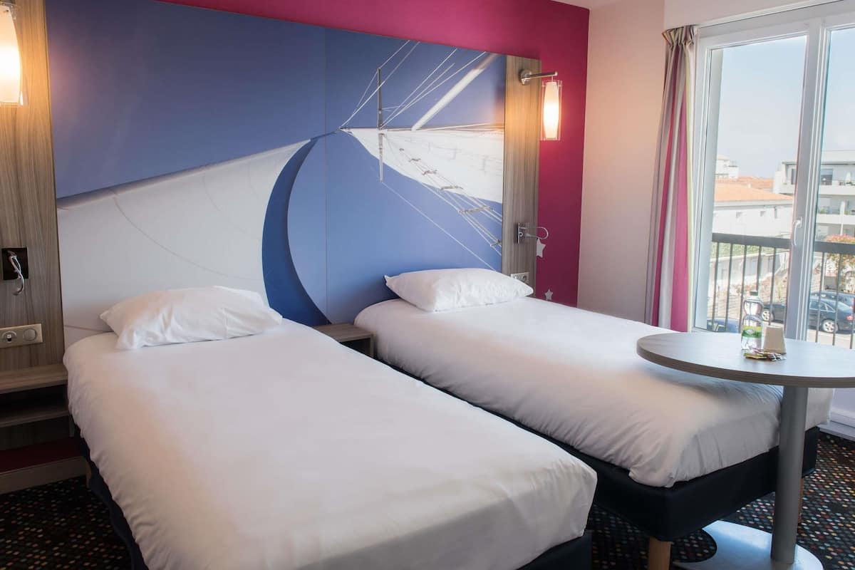 Premium bedding, pillow-top beds, desk, blackout curtains