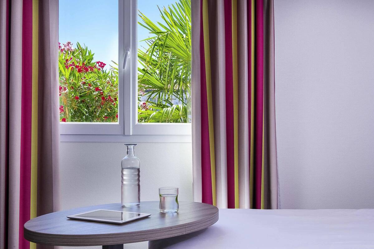 Premium bedding, pillow-top beds, desk, blackout curtains