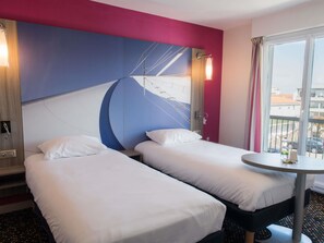 Premium bedding, pillowtop beds, desk, blackout drapes