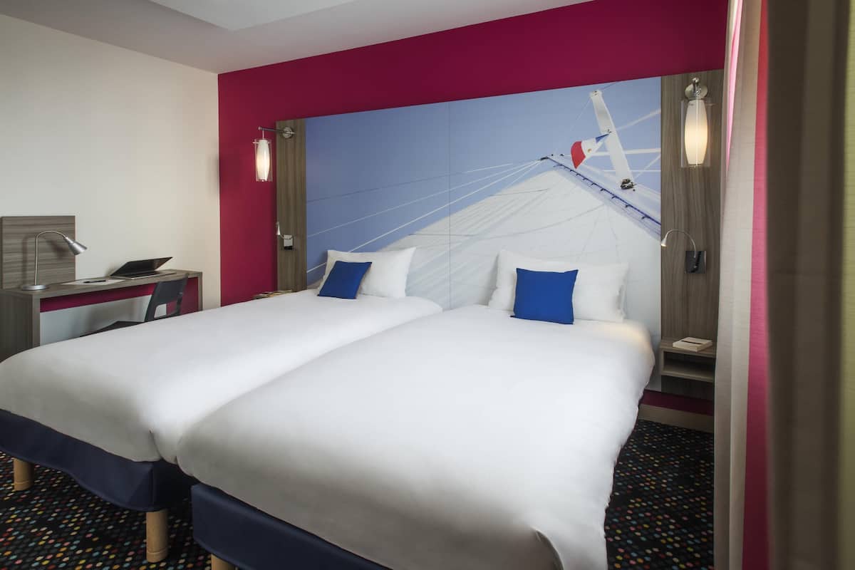 Premium bedding, pillow-top beds, desk, blackout curtains