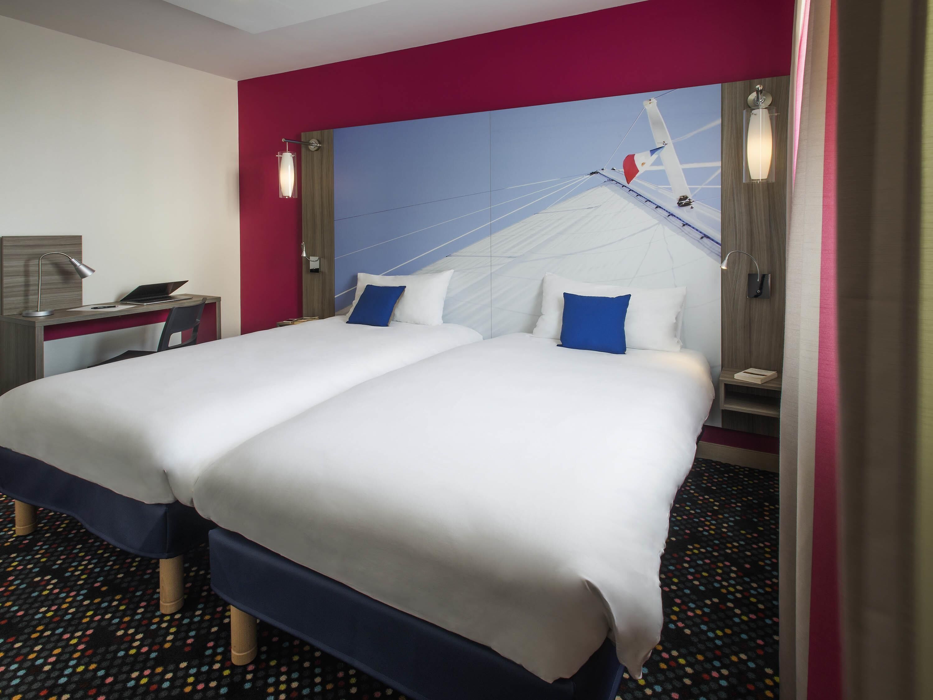 Premium bedding, pillow-top beds, desk, blackout curtains