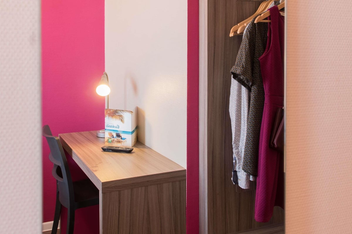 Premium bedding, pillow-top beds, desk, blackout curtains