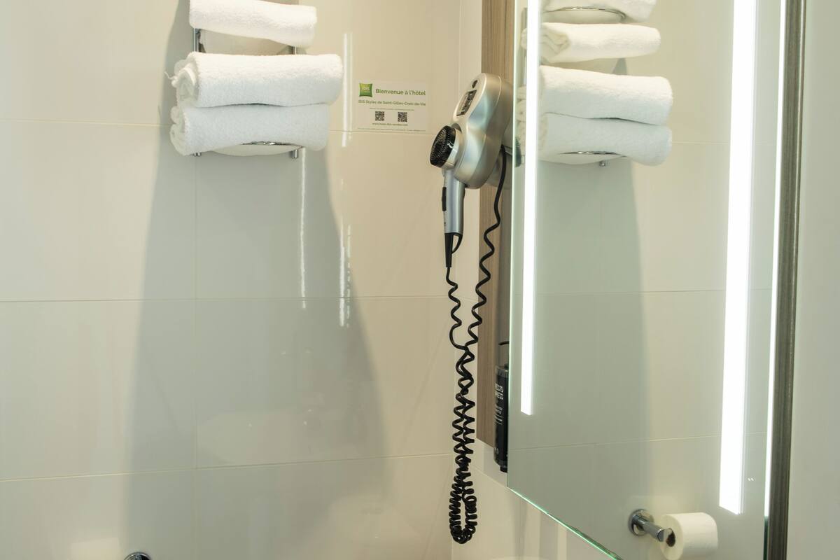 eco-friendly toiletries, hair dryer, towels, soap