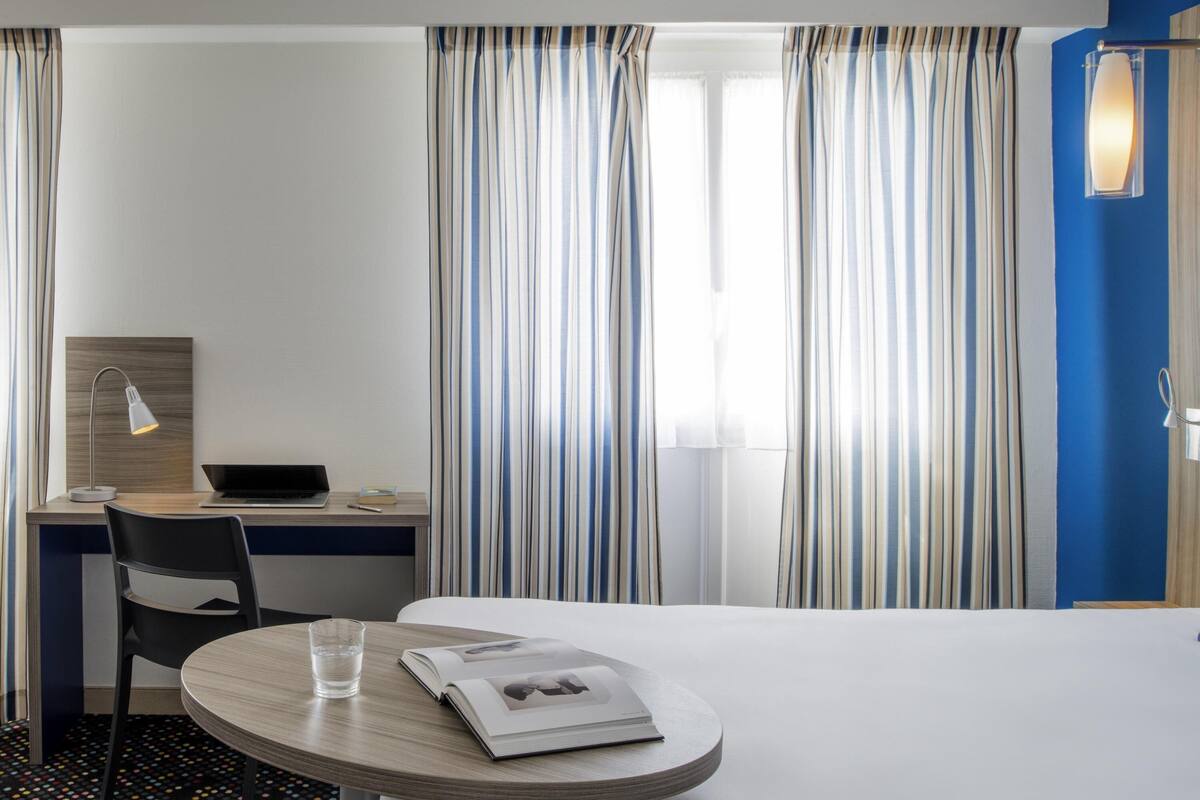 Premium bedding, pillow-top beds, desk, blackout curtains