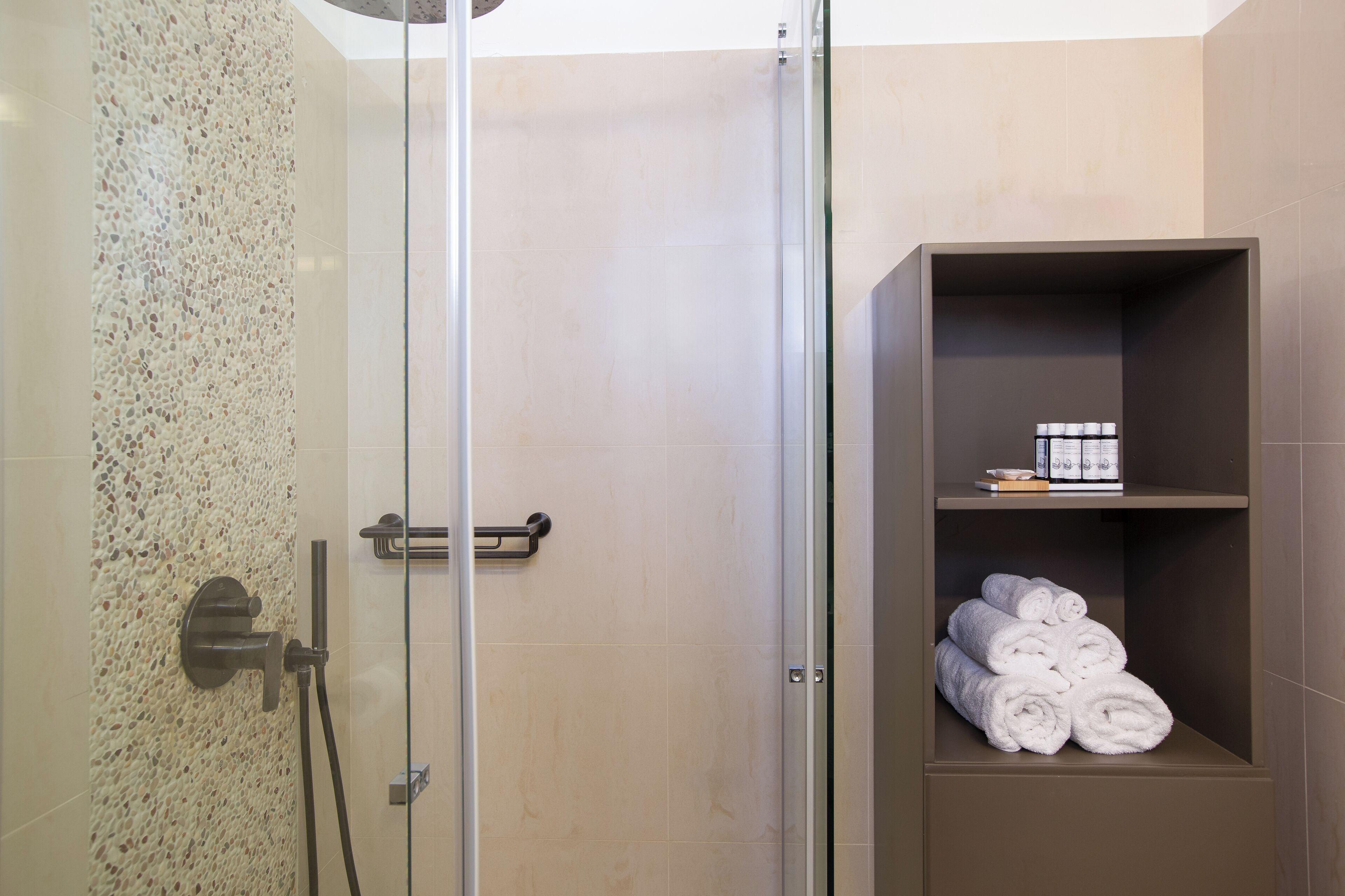 Designer toiletries, hair dryer, bathrobes, slippers