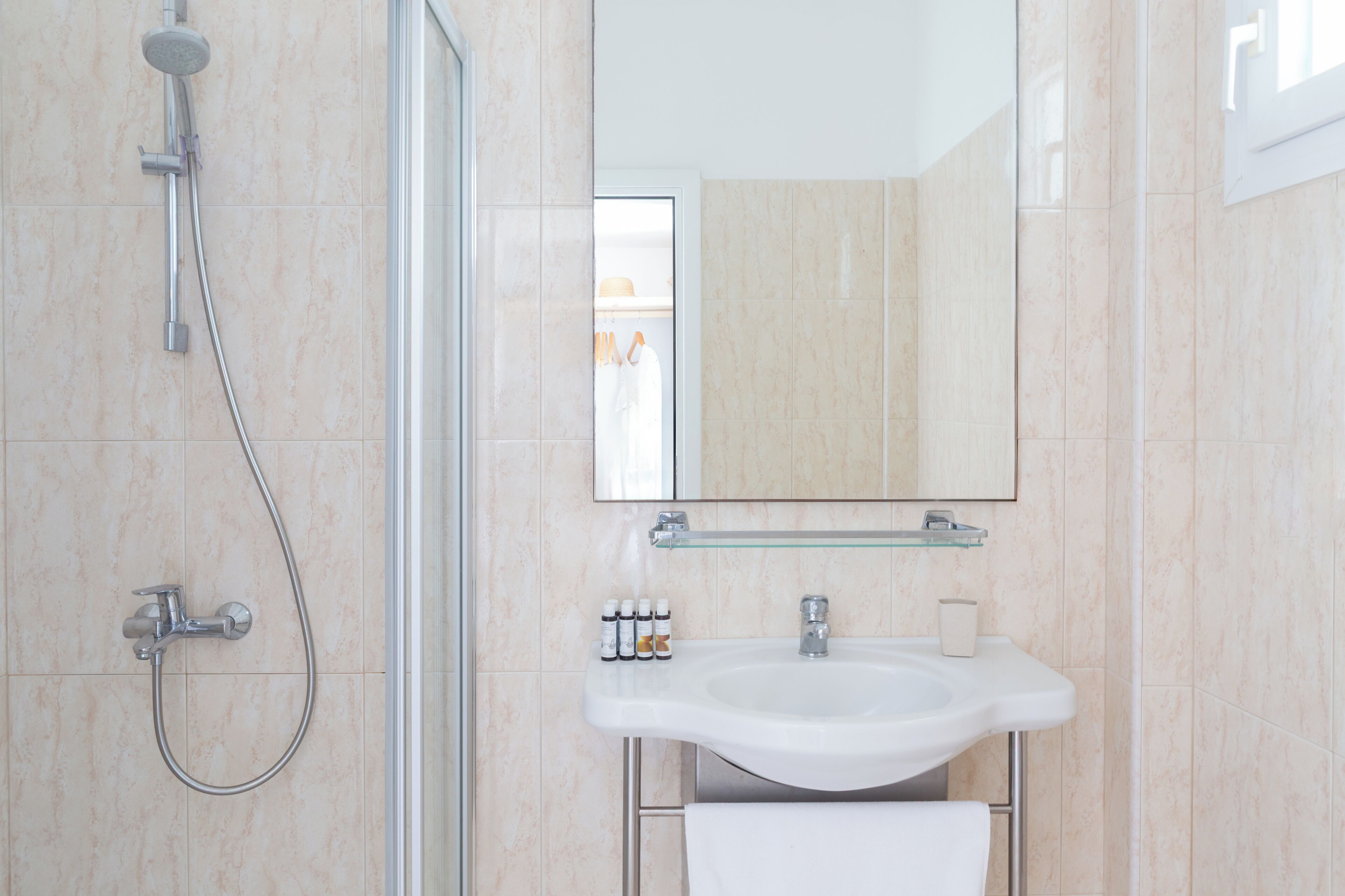 Designer toiletries, hair dryer, bathrobes, slippers