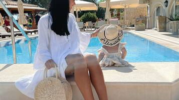 Indoor pool, seasonal outdoor pool, pool umbrellas, pool loungers