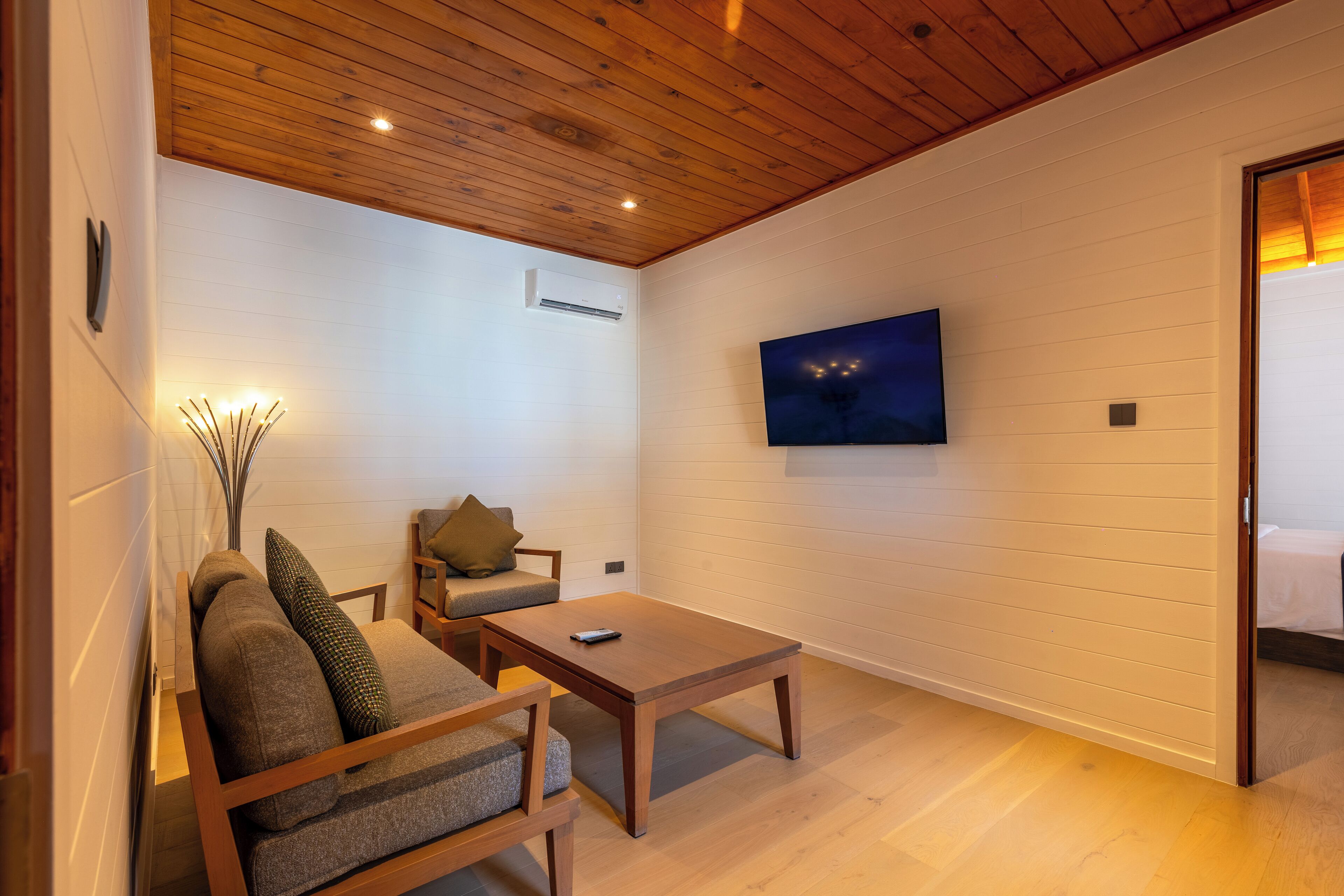 two bedroom beach pool villa | living area | flat-screen tv, ping pong