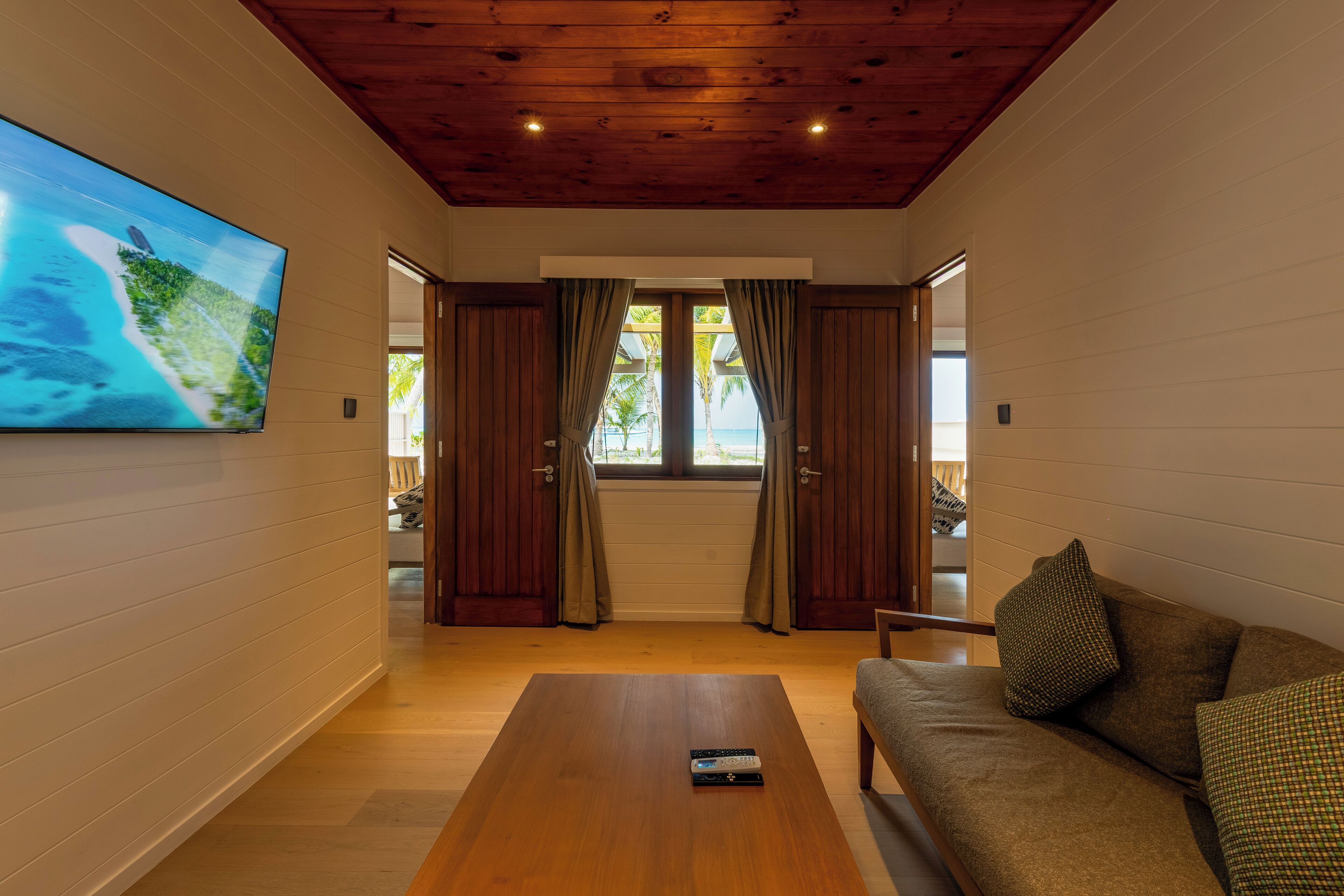 two bedroom beach pool villa | living area | flat-screen tv, ping pong