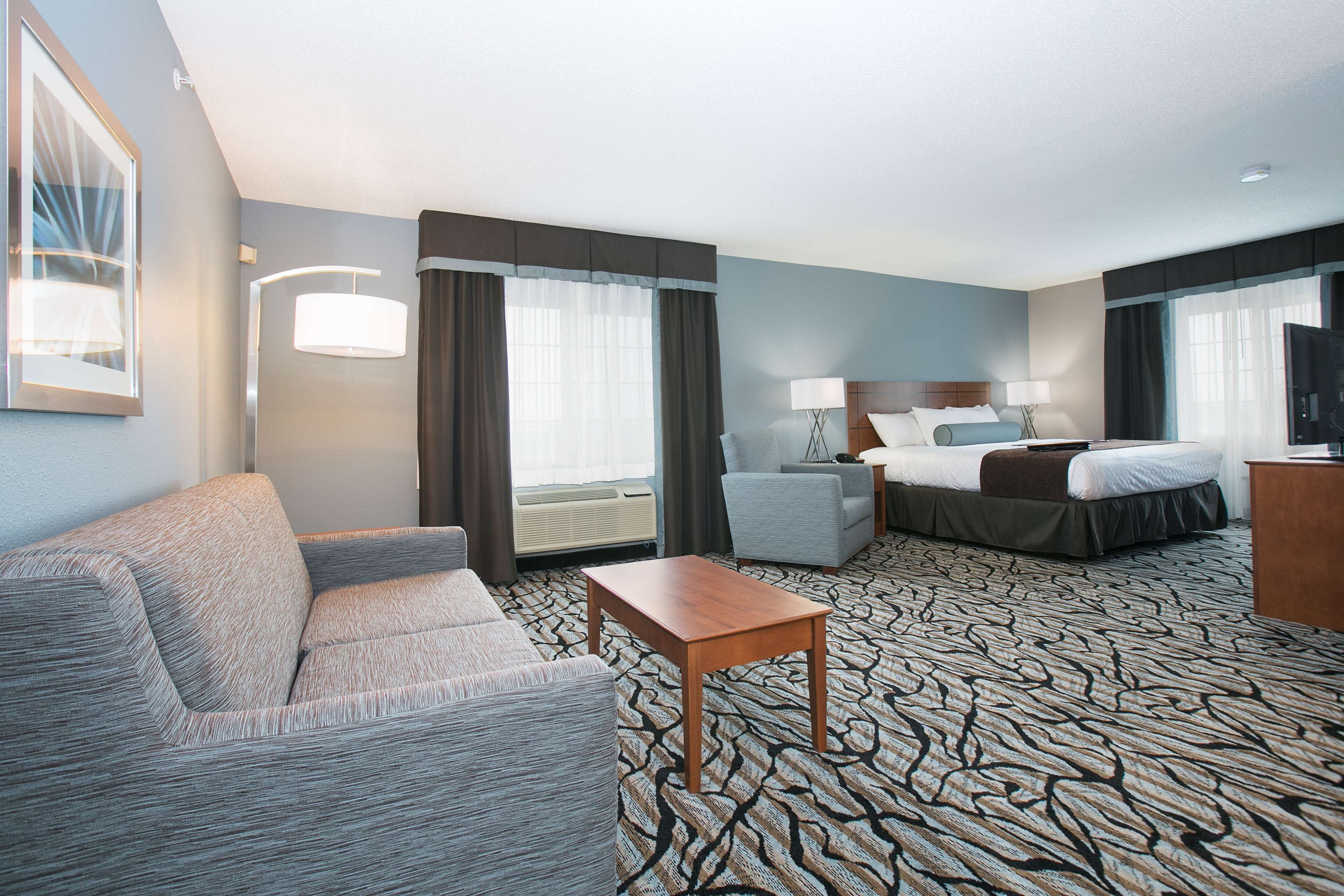 desk, laptop workspace, blackout curtains, iron/ironing board