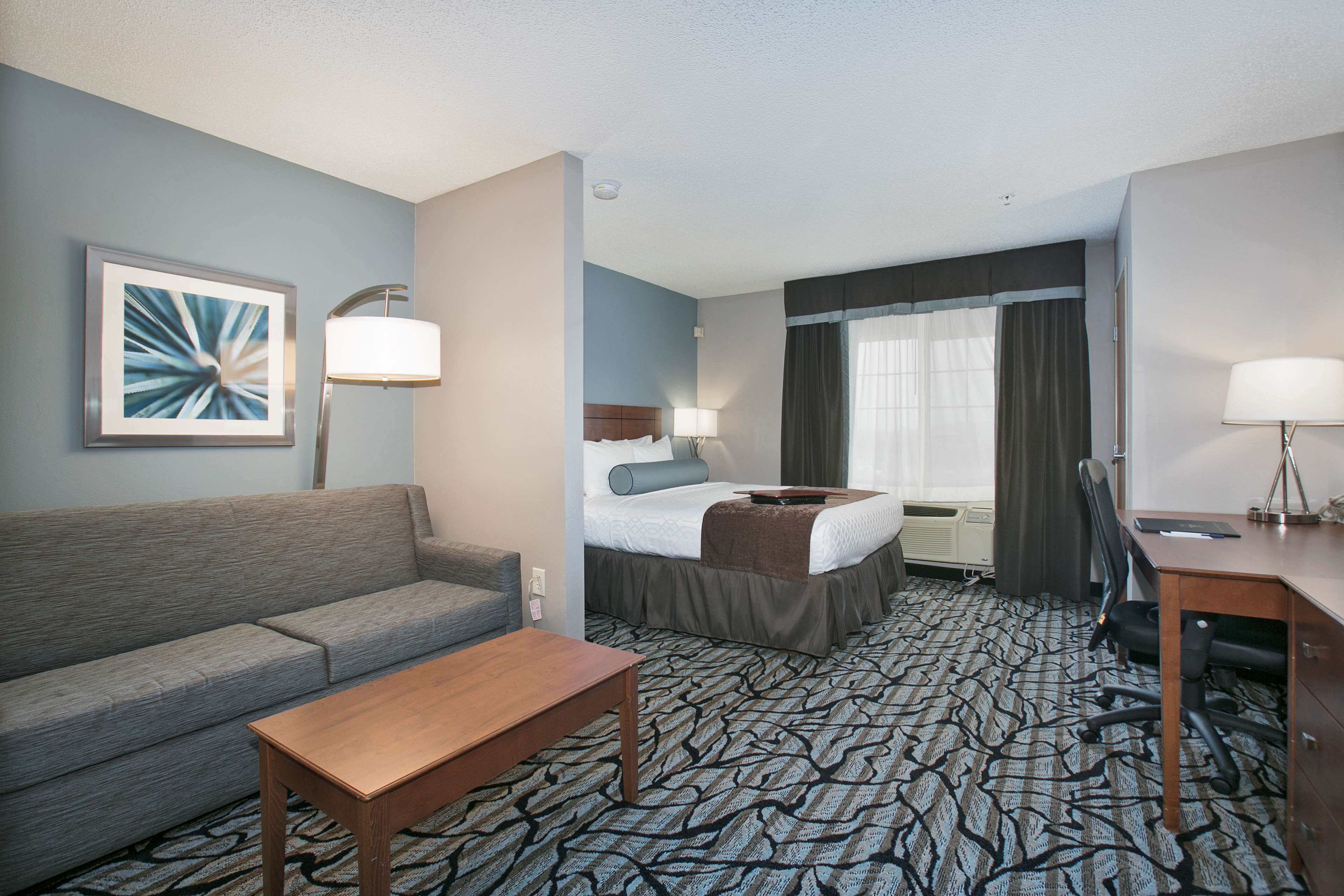 desk, laptop workspace, blackout curtains, iron/ironing board