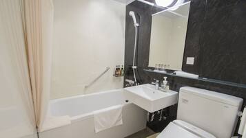 Combined shower/tub, free toiletries, hair dryer, slippers