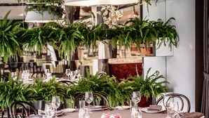 A dining area with round tables set for four, surrounded by chairs. - Rija VEF Hotel (Riga)