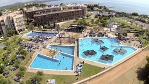 Relax by the pool or enjoy the ocean view from your balcony.