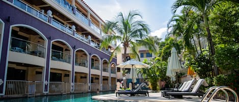 2 outdoor pools, open 7:00 AM to 7:00 PM, pool umbrellas