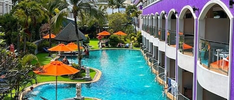 2 outdoor pools, open 7:00 AM to 7:00 PM, pool umbrellas