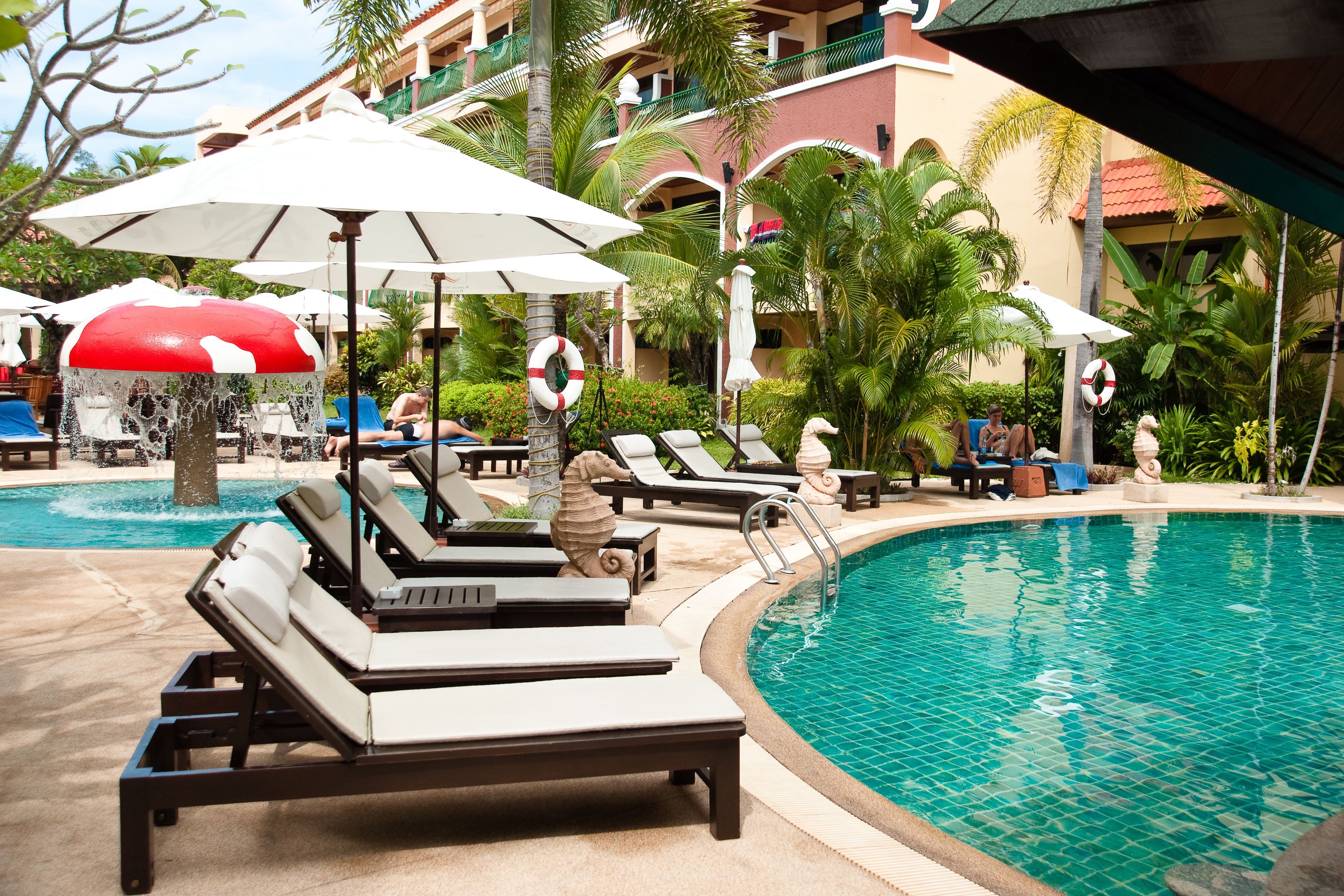 2 outdoor pools, open 7:00 am to 7:00 pm, pool umbrellas