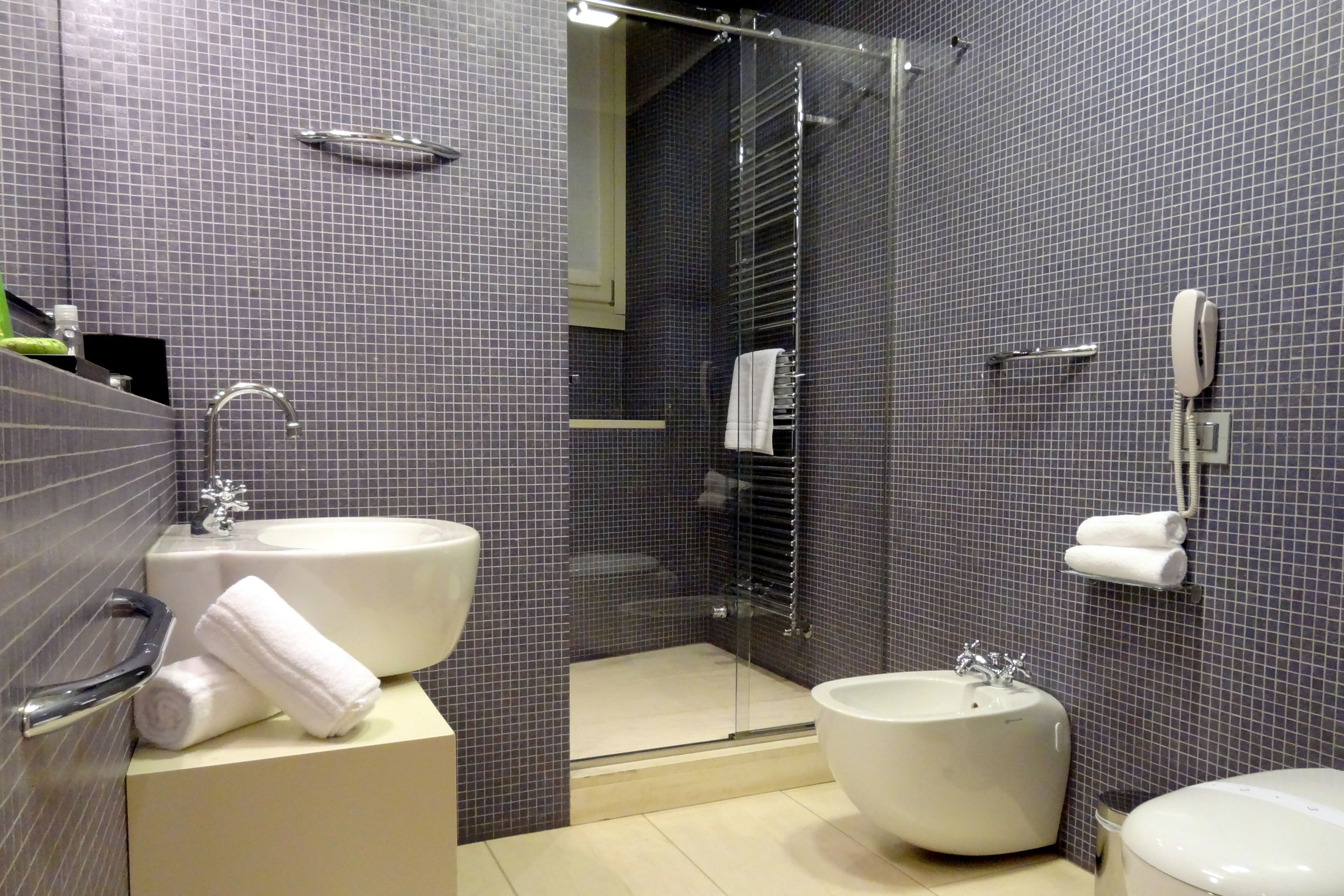 comfort room | bathroom | hair dryer, slippers, bidet, towels