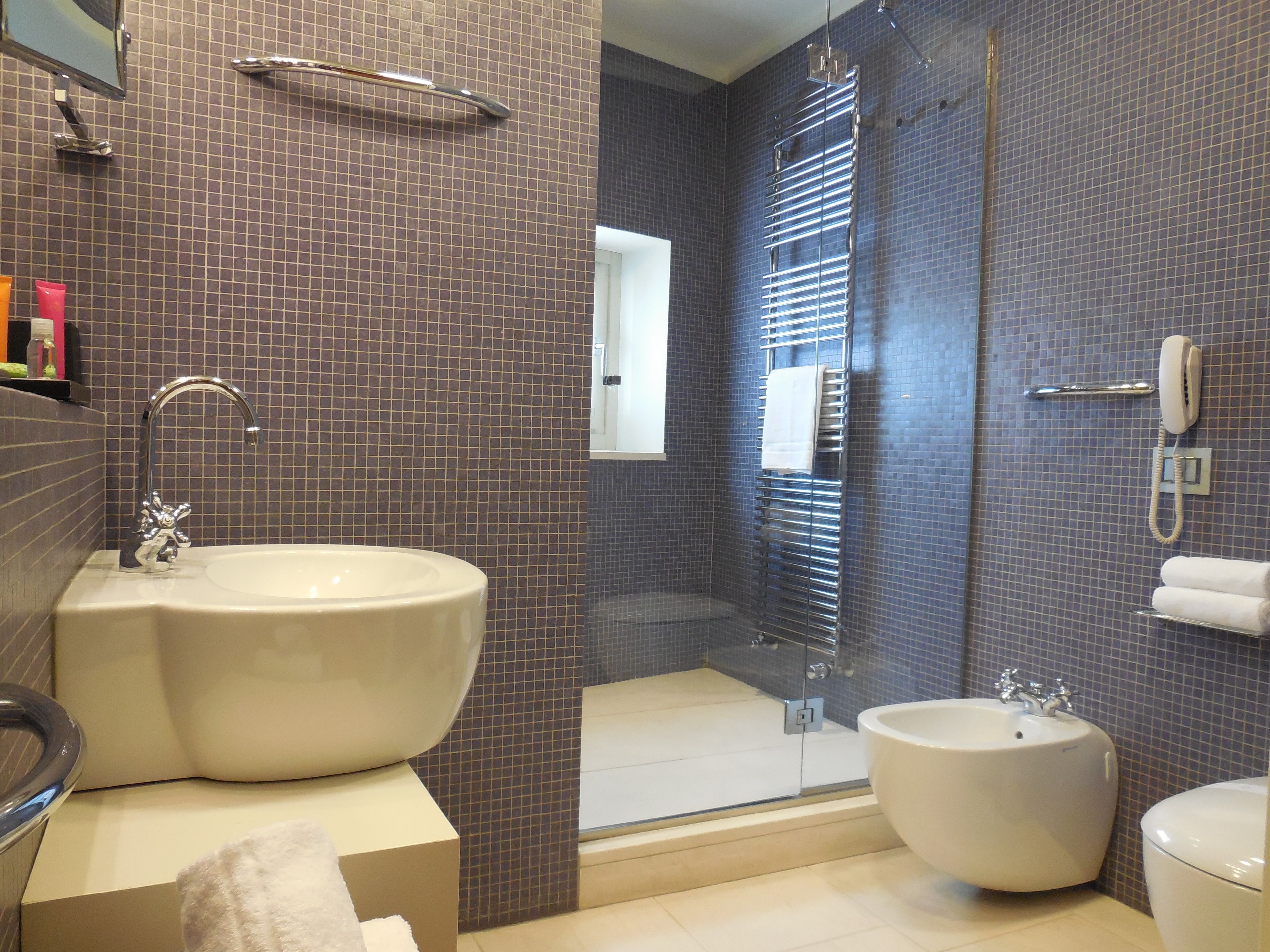 comfort room | bathroom | hair dryer, slippers, bidet, towels