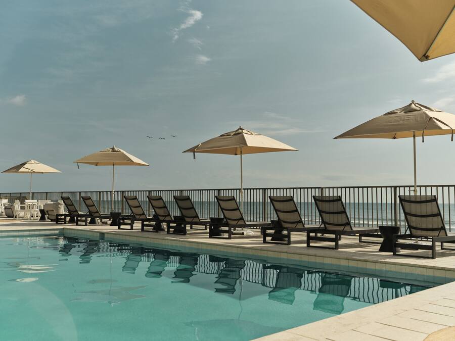Outdoor pool, pool umbrellas, sun loungers