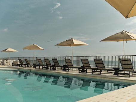 Outdoor pool, pool umbrellas, sun loungers