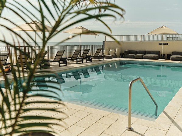 Outdoor pool, pool umbrellas, sun loungers