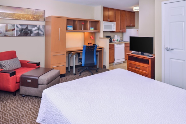 Premium bedding, desk, laptop workspace, blackout drapes