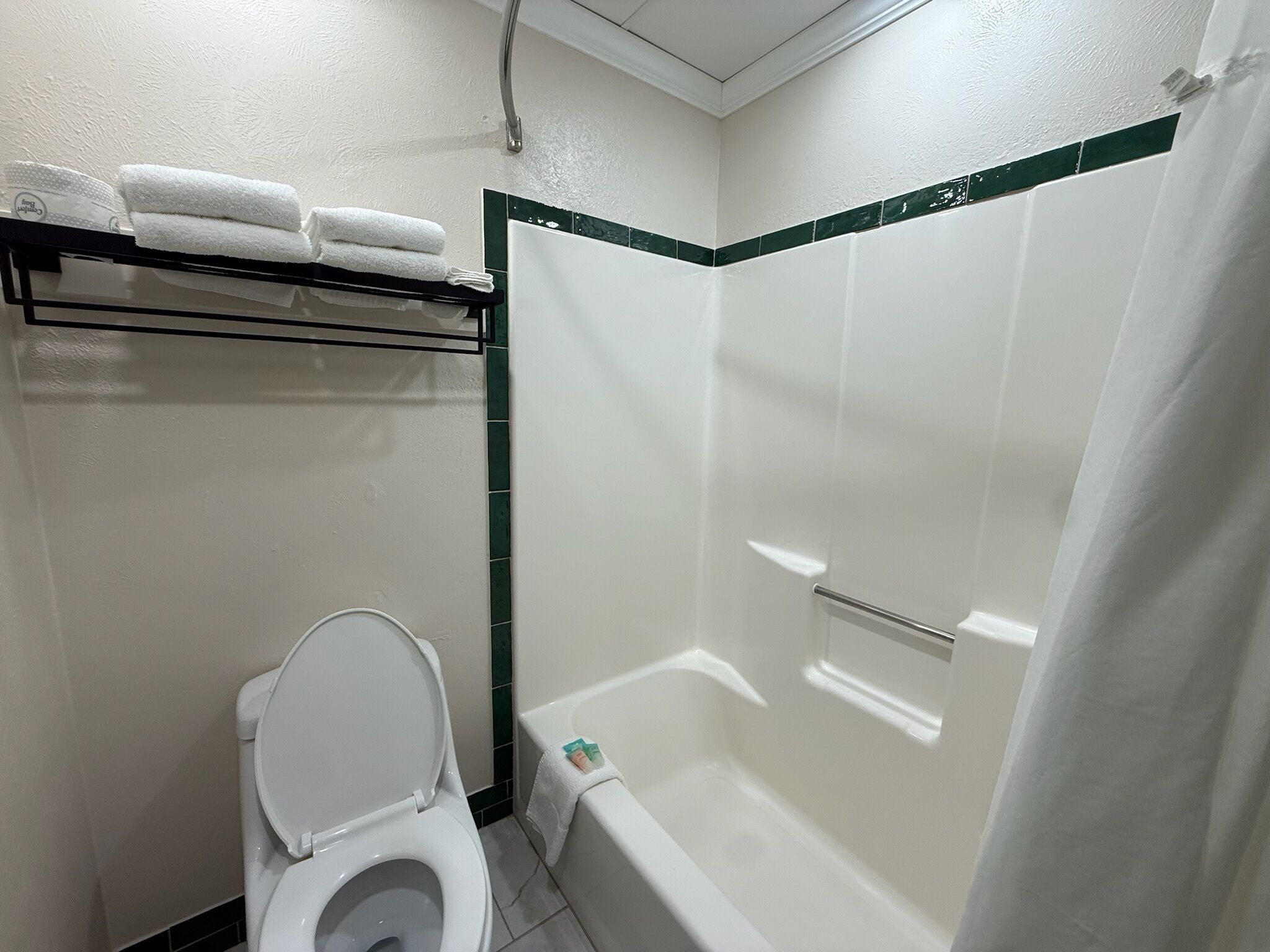 Combined shower/tub, hair dryer, towels, soap