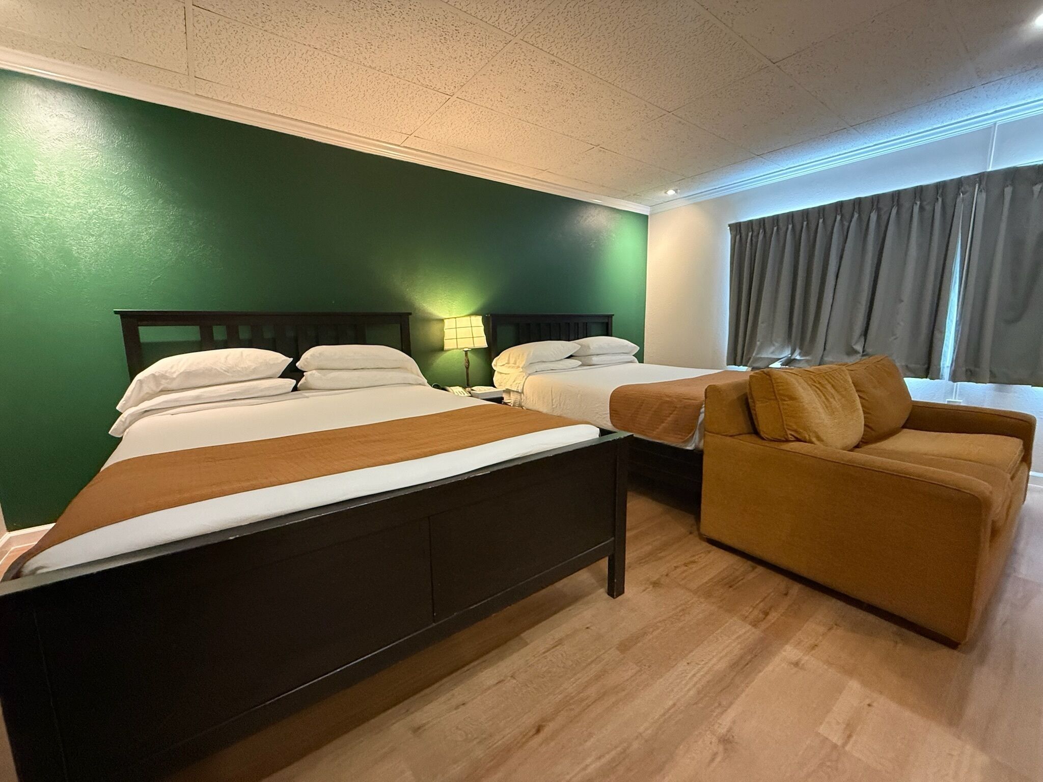 Deluxe Quadruple Room, 2 Queen Beds, Mobility Accessible | Premium bedding, down comforters, in-room safe, desk