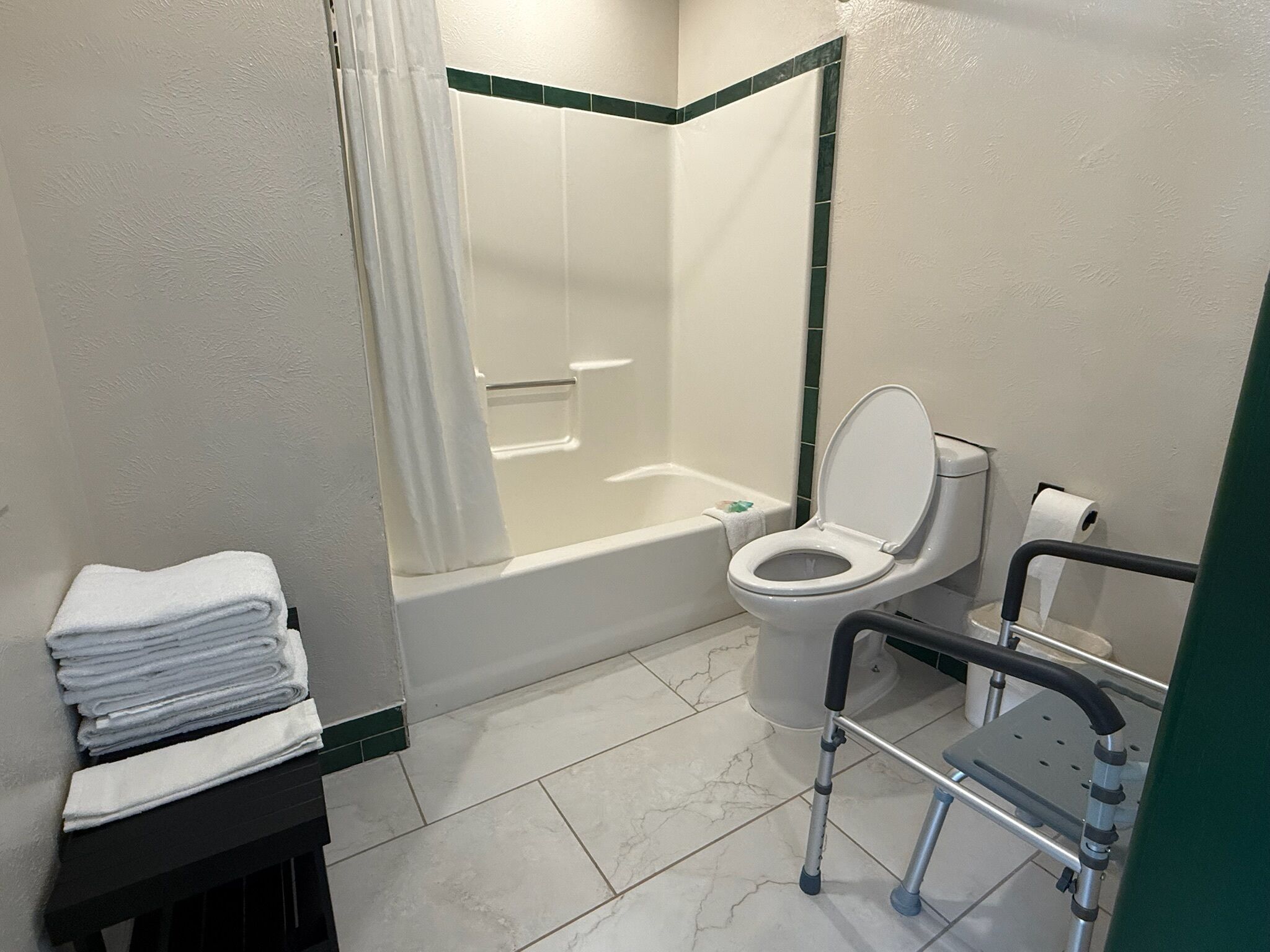 Combined shower/tub, hair dryer, towels, soap