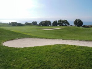 A golf course with sand bunkers, green fairways, and trees. - Staybridge Suites Lake Forest by IHG (Foothill Ranch)
