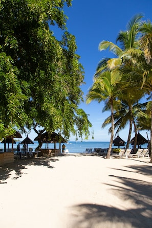 On the beach, sun loungers, beach umbrellas, beach towels
